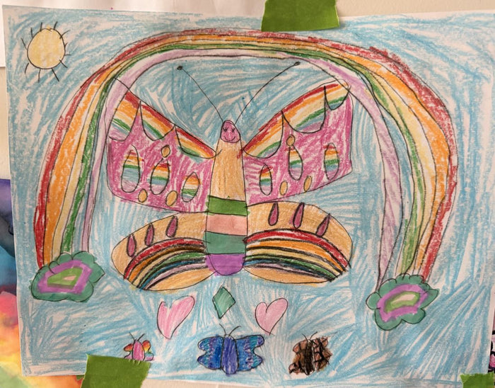 Crayon and marker drawing of a large striped butterfly under a double rainbow with flowers