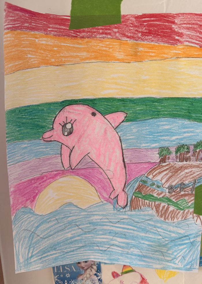 Colored pencil drawing of a pink dolphin jumping in front of a striped sunset