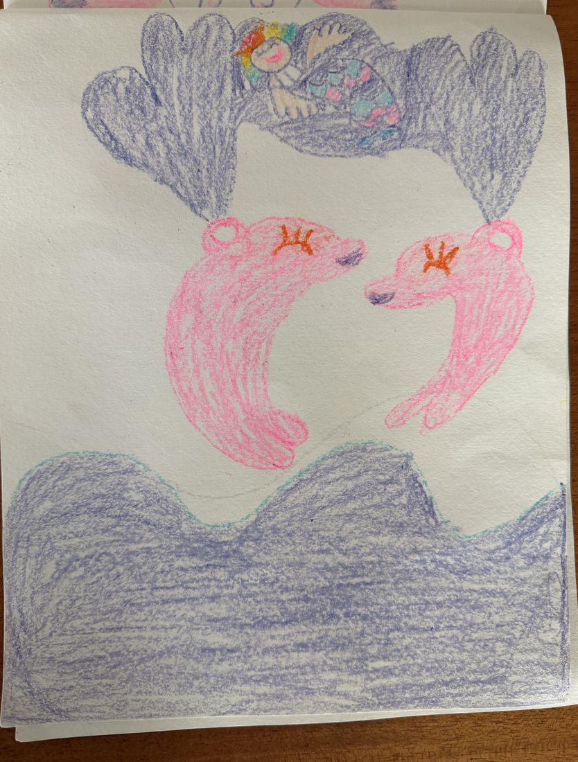 Crayon drawing of two pink dolphins leaping over purple waves