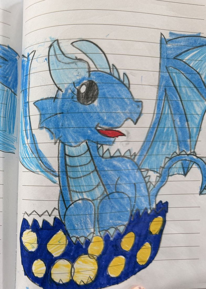 Colored pencil sketchbook drawing of a blue dragon with spiky wings