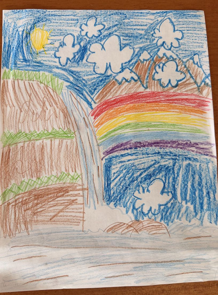 Colored pencil drawing of a waterfall between cliffs with a rainbow and clouds